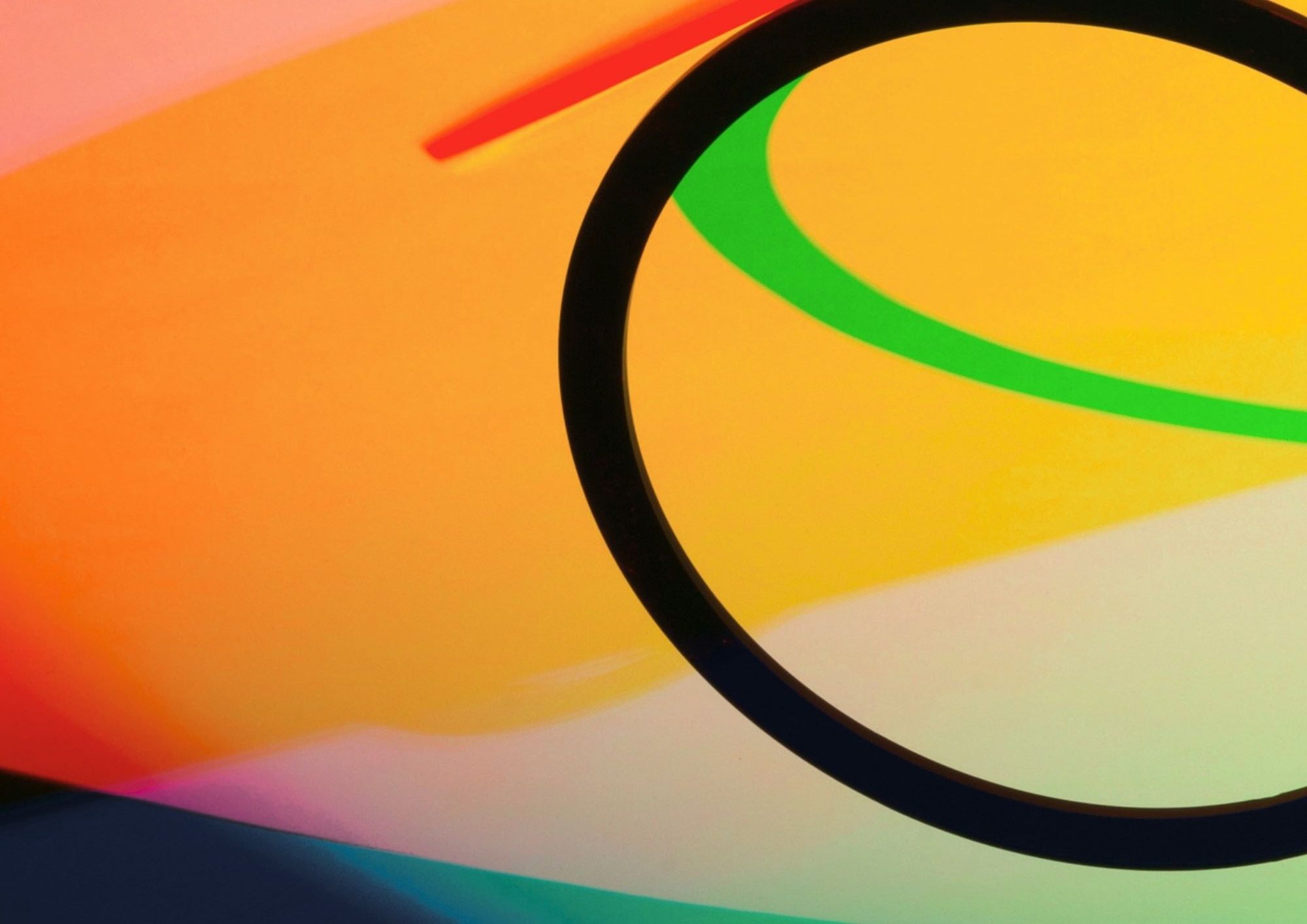 black circle with orange background, and green arc in the middle